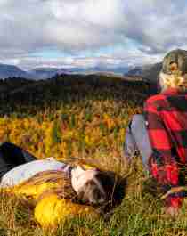 Two girls relaxing and enjoying the view of the autumn/fall forest in Hemsedal, Eastern Norway