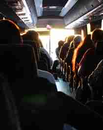 Picture of a group on a bus, taken from inside