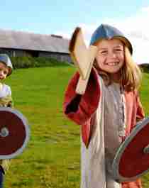 Two children wearing viking costumes at Stiklestad National Culture Centre