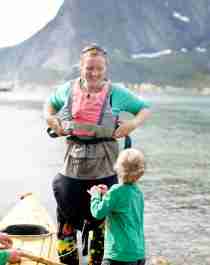 A family with a kayak in Lofoten, Northern Norway