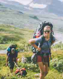 People summer hiking in mountainous landscape in Indre Troms, Northern Norway