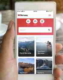 A person uses the Visit Norway app on a mobile phone