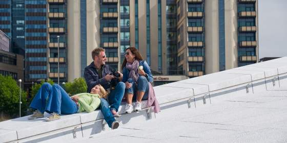 People relaxing on the roof of the Oslo Opera building