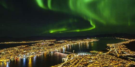 Northern lights over Tromsø city at night