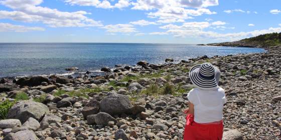 Woman overlooking sea at Bjellandstrand beach