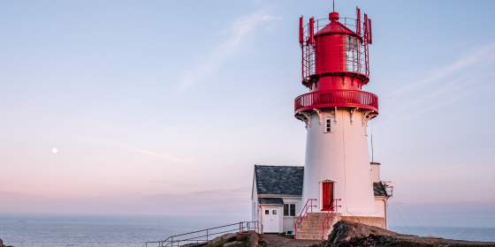 Lindesnes lighthouse in Southern Norway during sunset.