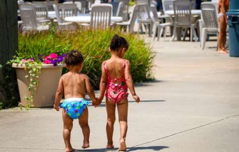 Siblings holding hands at Roseland Waterpark in Canandaigua