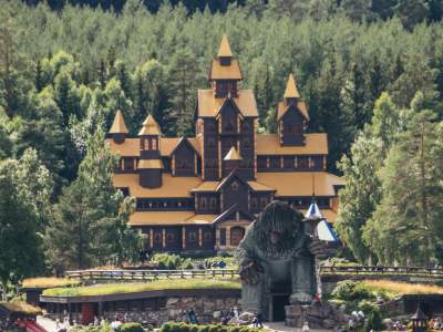 A view of Hunderfossen fairytale park with the Hunderfossen troll in front of the Farytale castle