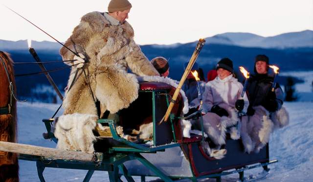 A horse-drawn sleigh with a group of people who are warmly dressed at Gålå, Gudbrandsdalen, Eastern Norway