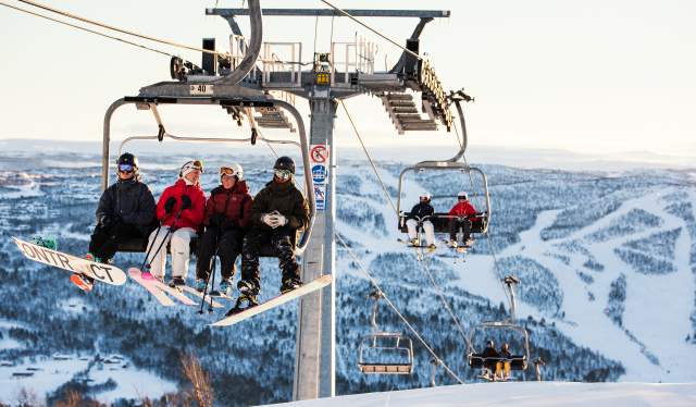 Skiers in the chairlift in Geilo