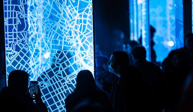 People looking at light art at FjordOslo light art festival 2022 in Oslo