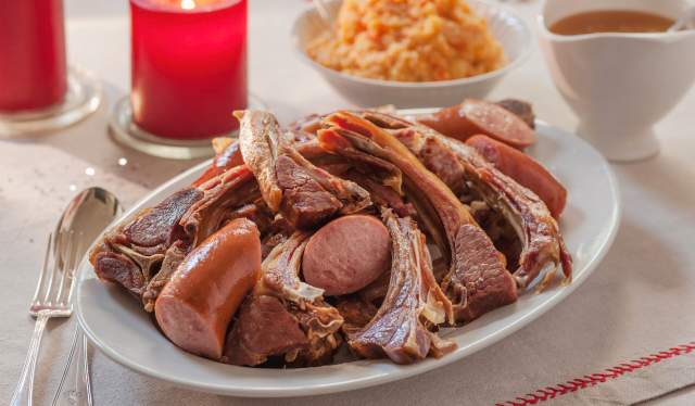 A serving of pinnekjøtt with sausage and mashed turnips