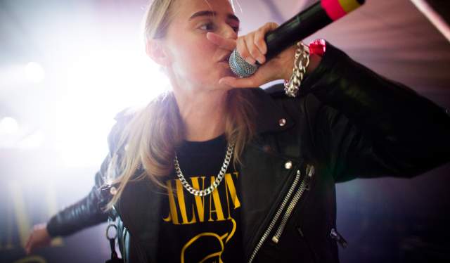 Close-up image of a singer with a Nirvana T-shirt
