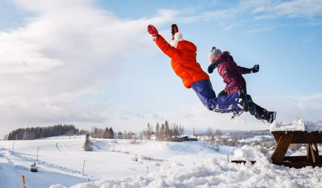 Kids jumping in the snow in Steinkjer