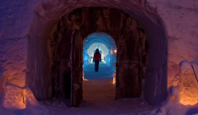 A person in silhouette at the Sorrisniva Igloo Hotel in Finnmark, Northern Norway