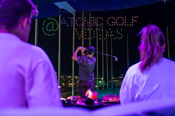 A player enjoying a game at Atomic Golf at the STRAT Hotel, Casino & Tower.