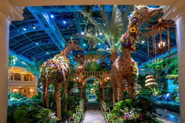Two large giraffes adorned in flowers at the Bellagio Conservatory & Botanical Gardens.