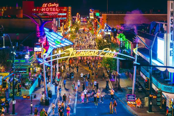 Groups of people walking down Fremont Street in Downtown Las Vegas.