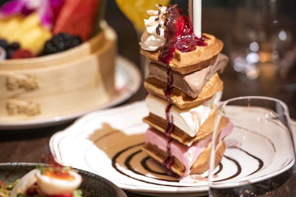 A delicious stacked waffle with ice scream and strawberries at CATCH, an Asian-influenced sushi, seafood and steak restaurant, at The ARIA.