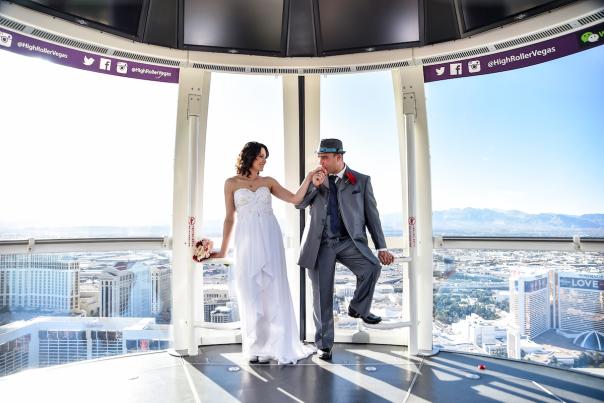 A newly wed couple celebrating their marriage inside of the The High Roller at The Linq Hotel + Experience.