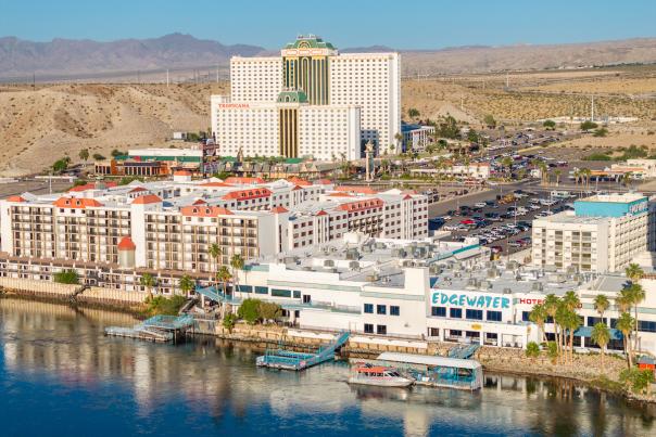 A skyline view of Laughlin during the day with a stunning mountain range in the background.
