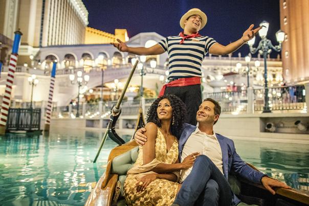 A couple enjoys a gondola ride at The Venetian Resort in Las Vegas