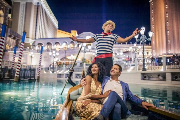 A couple enjoys themselves at the Gondola Ride available at The Venetian.
