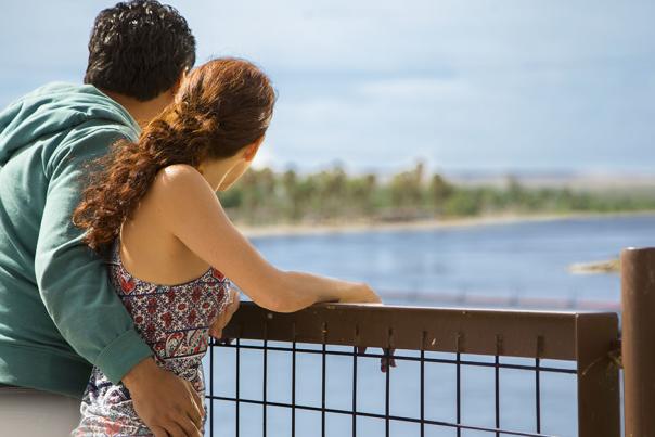 A couple overlooking a beautiful river.