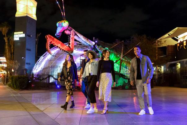 A group of friends walking in Downtown Container park in Las Vegas.