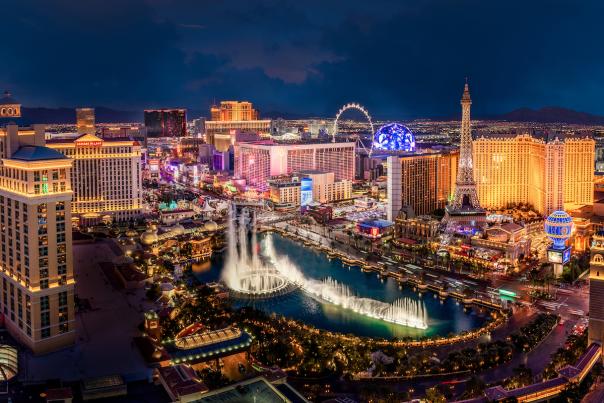 Aerial view of the Las Vegas Strip at night with the Fountains of Bellagio display on.