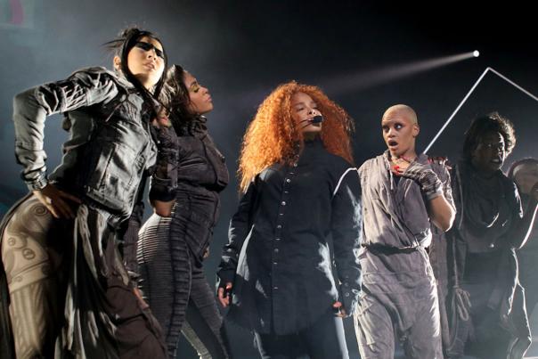 Janet Jackson and performers on stage.