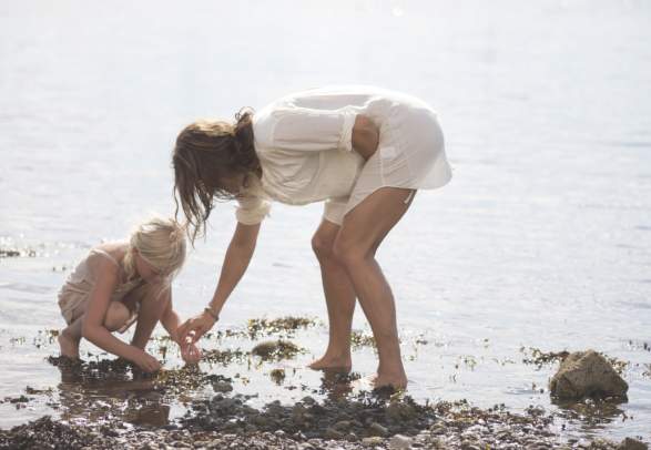 Mother and child playing at the beach in Moss