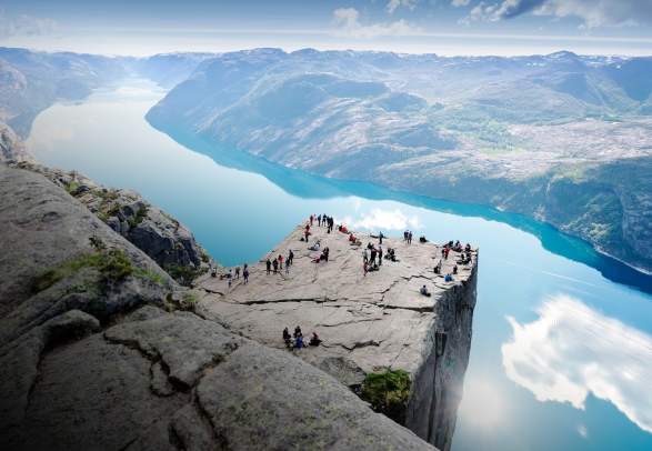 People standing on Preikestolen mountain in Lysefjorden in Fjord Norway