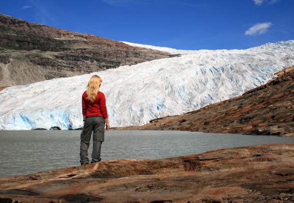 Woman standing in front of Svartisen glacier