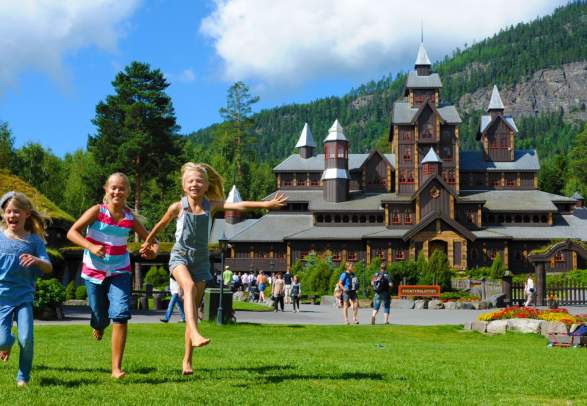 Children playing outside on a sunny summer day at Hunderfossen family park