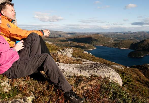 Two people enjoying the view of Sirdal's mountain landscape