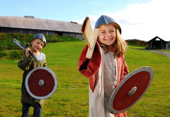 Two children wearing viking costumes at Stiklestad National Culture Centre