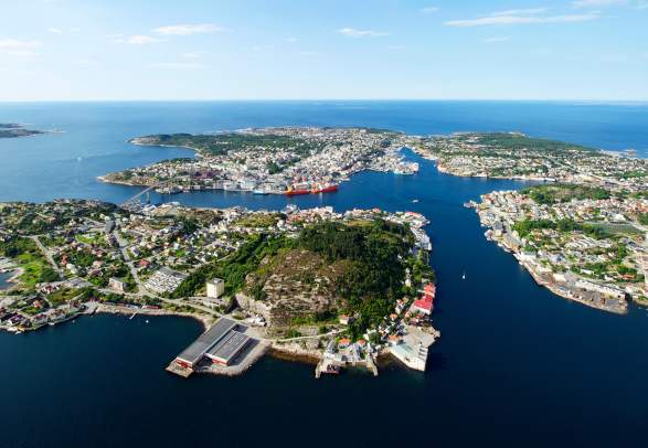 Overview of the city Kristiansund in Fjord Norway from above in the sunshine.