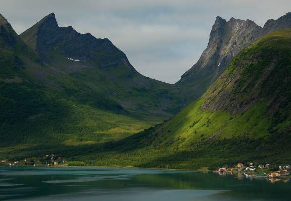Majestic mountains rising from the sea in Senja