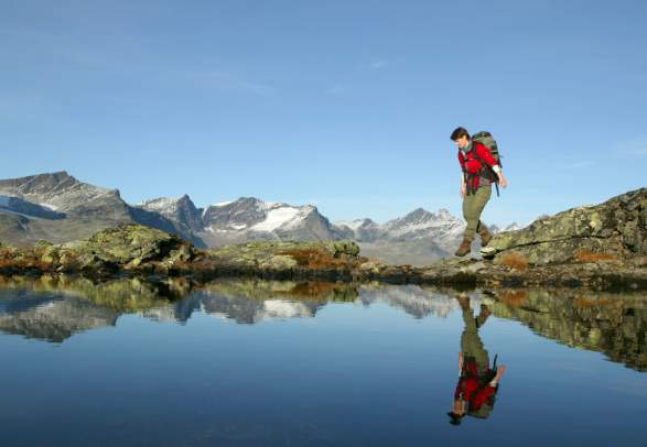 Woman walking the Besseggen ridge in Valdres