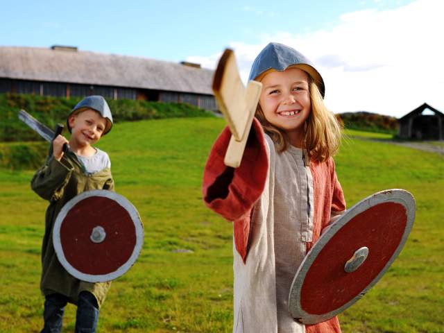 Two children wearing viking costumes at Stiklestad National Culture Centre
