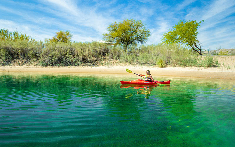 A woman paddles a kayak through Big Bend Park in Laughlin, NV