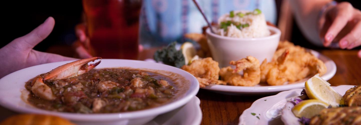 Cajun Creole Restaurants In Baton Rouge Southern Cuisine Tasty Spread Of Gumbo Fish And Shrimp Dishes With Local Beer To Wash It Down
