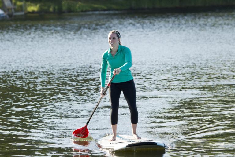 girl paddleboarding