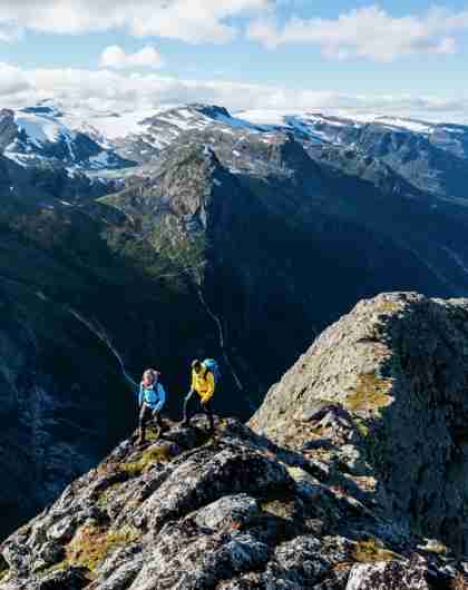 Two people hiking Mount Kattanakken in Jostedalsbreen national park, Fjord Norway