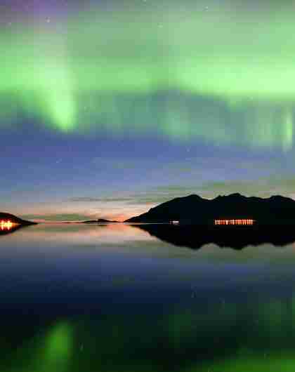 Northern lights over Grøtfjord in Kvaløya, Northern Norway