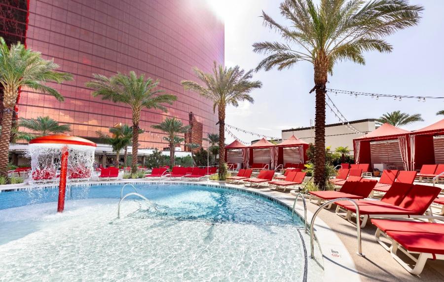 The pool and deck chairs at Resorts World Las Vegas