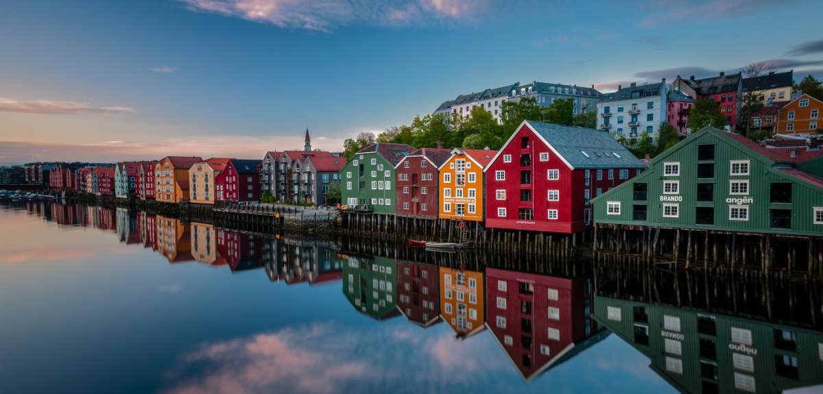Old historic buildings along the river Nidelva in Trondheim, one of Norway’s top places to go