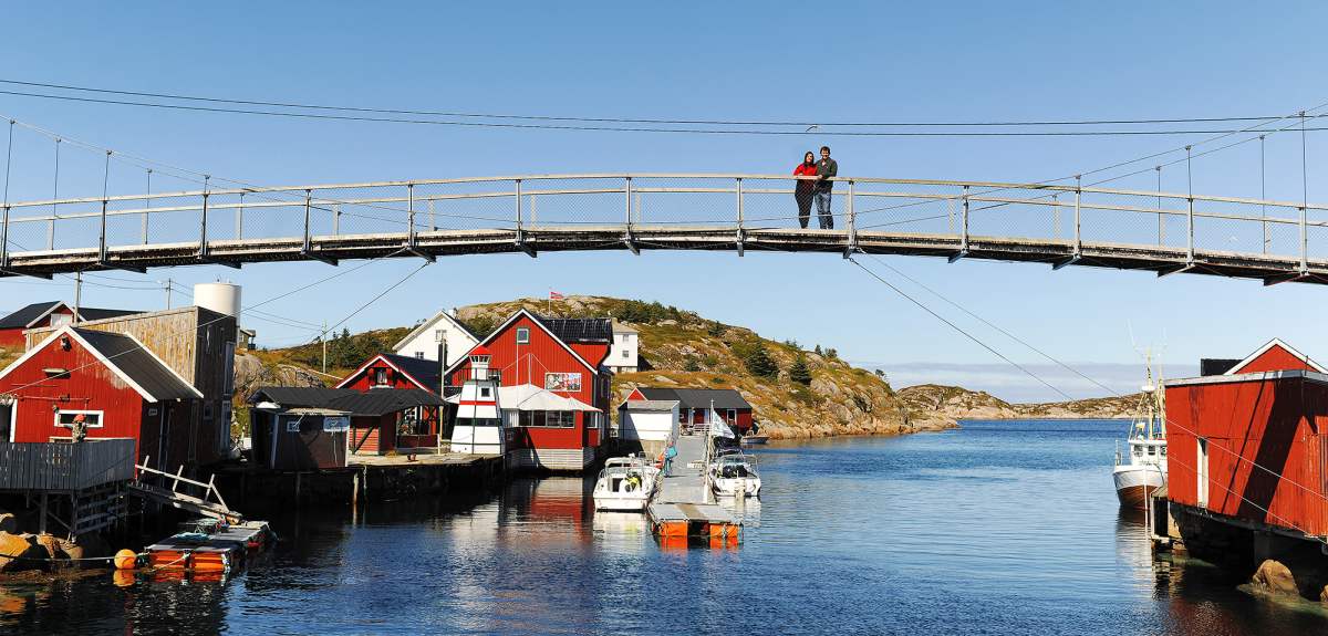 A couple standing on a bridge in Trondelag