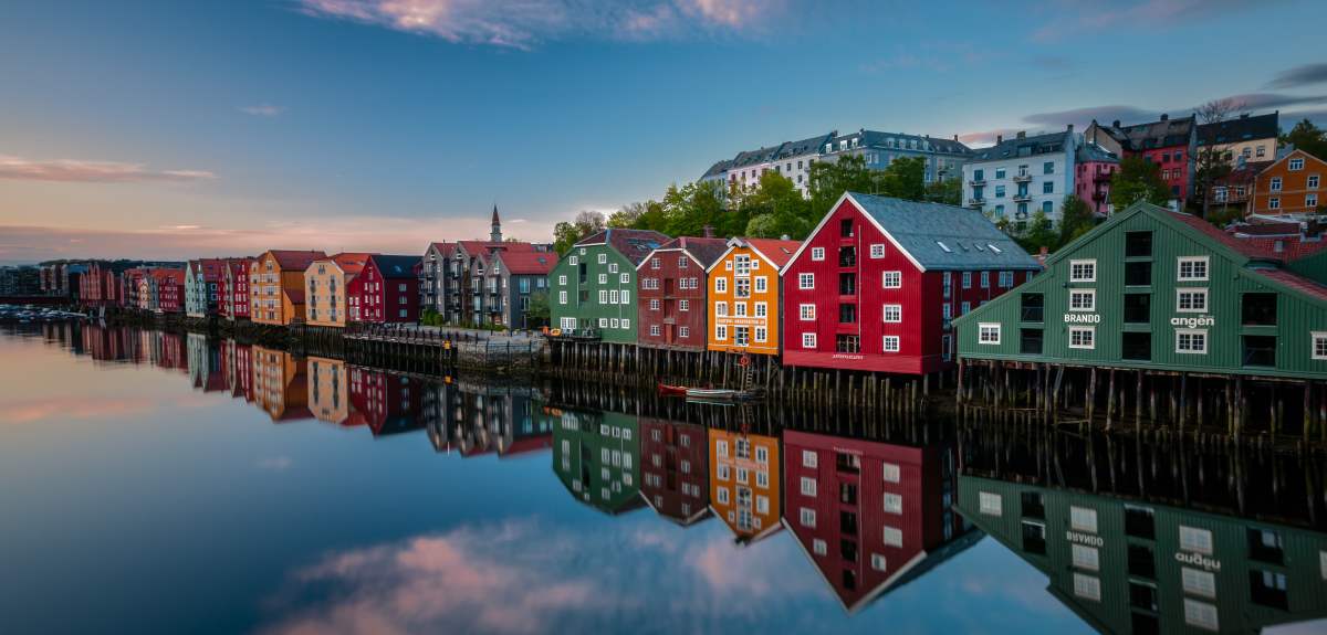 Old historic buildings along the river Nidelva in Trondheim, one of Norway’s top places to go
